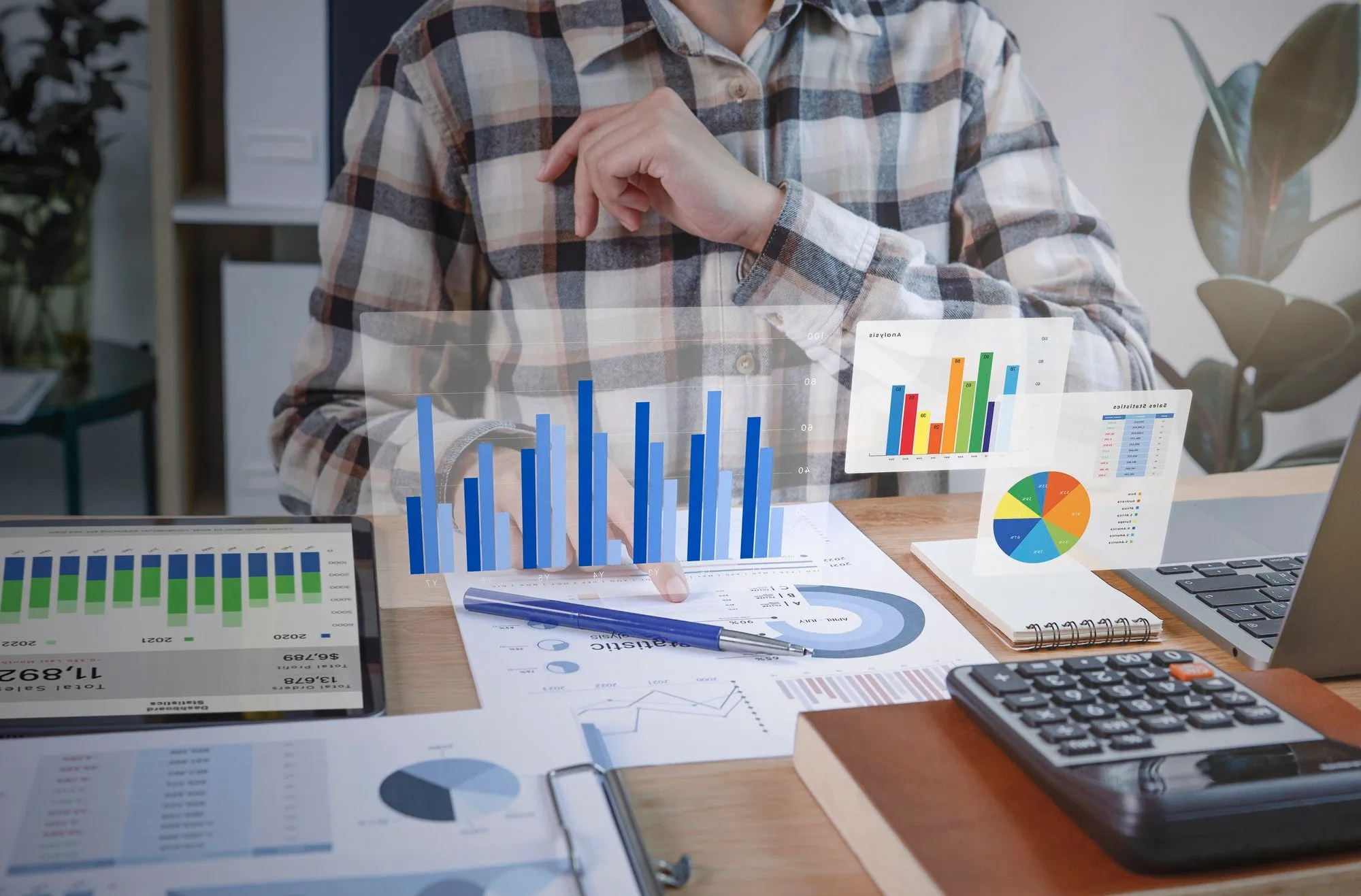 Credit analysis charts and a calculator on a desk
