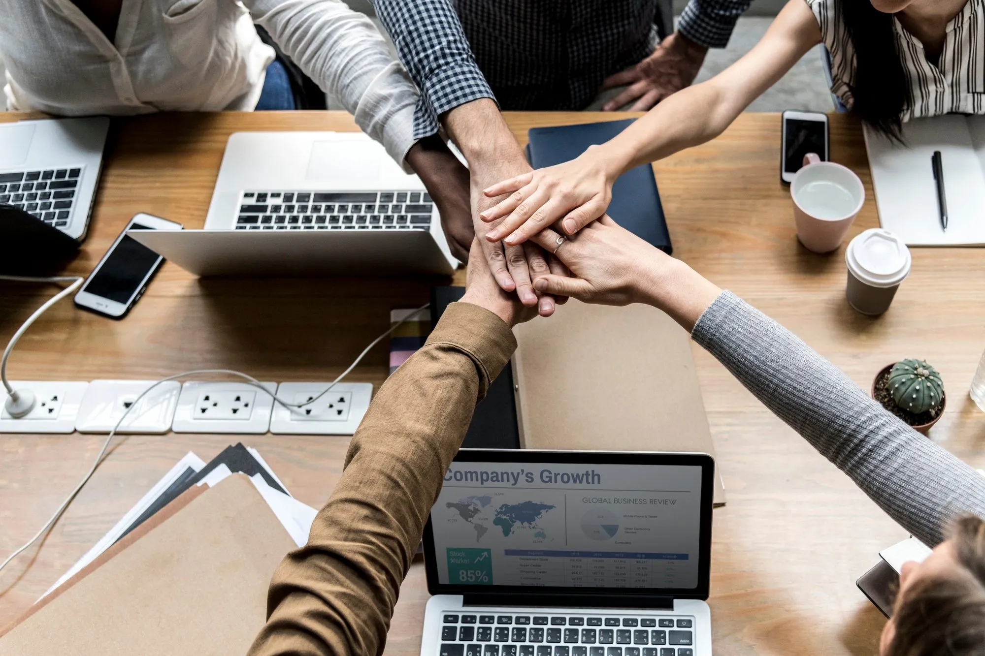 Colleagues collaborating around a desk