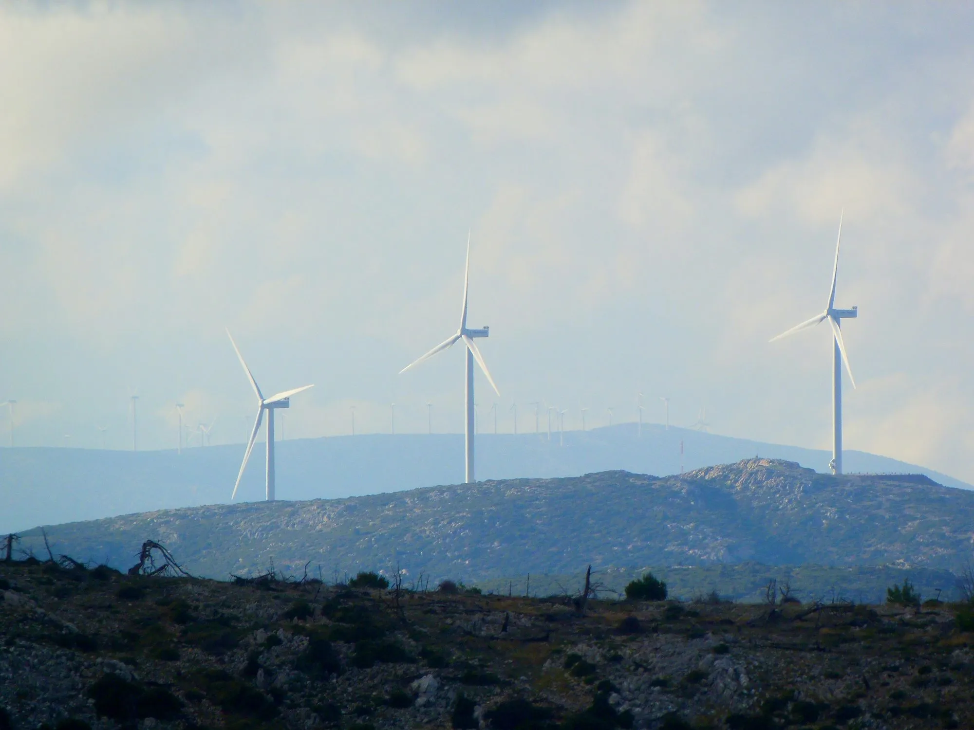 Wind turbines across a mountain landscape